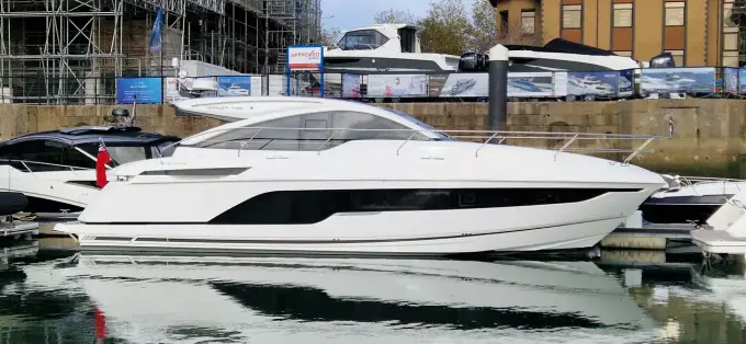 2025 Fairline Targa 45 Open yacht docked in a marina, showcasing sleek design and luxury.