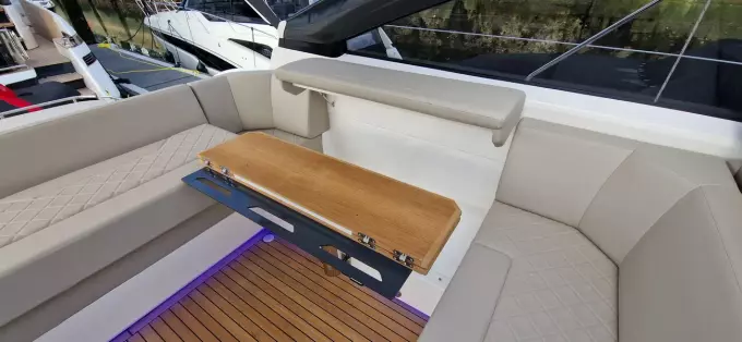 2025 Fairline Targa 45 Open yacht interior with beige seating and wooden accents.