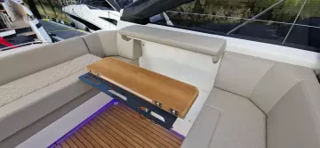 2025 Fairline Targa 45 Open yacht interior with beige seating and wooden accents.