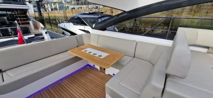 2025 Fairline Targa 45 Open yacht interior with elegant seating and wooden table.