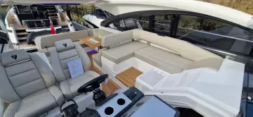 2025 Fairline Targa 45 Open yacht interior with luxurious seating and modern helm.