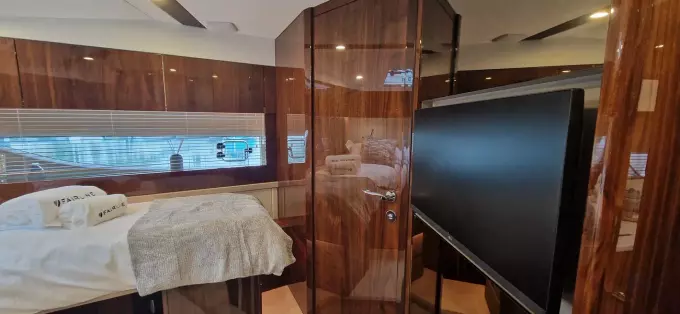 Luxurious interior of 2025 Fairline Targa 45 Open yacht with wood paneling and modern amenities.