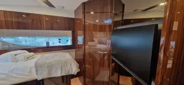 Luxurious interior of 2025 Fairline Targa 45 Open yacht with wood paneling and modern amenities.