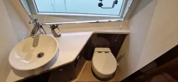 Modern bathroom in 2025 Fairline Targa 45 Open yacht with sink and toilet.