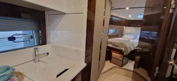 Luxurious interior of 2025 Fairline Targa 45 Open yacht, featuring bedroom and bathroom.