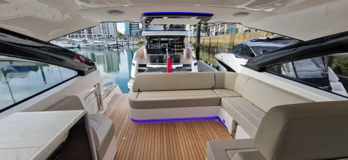 2025 Fairline Targa 45 Open yacht interior with modern seating and marina view.