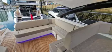 2025 Fairline Targa 45 Open yacht with elegant seating and modern design in a marina.