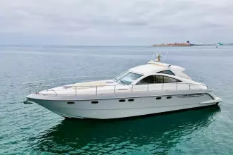 2006 Fairline Targa 52 GT yacht on calm sea, side view.