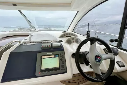 2006 Fairline Targa 52 GT yacht helm with navigation equipment and steering wheel.