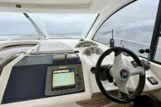 2006 Fairline Targa 52 GT yacht helm with navigation equipment and steering wheel.