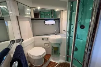 Luxurious bathroom in 2006 Fairline Targa 52 GT yacht with modern fixtures and shower.