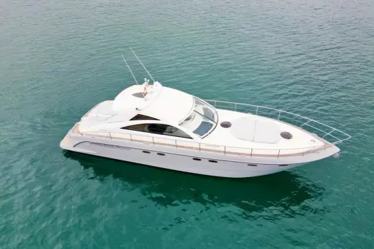 2006 Fairline Targa 52 GT yacht cruising on clear blue water.