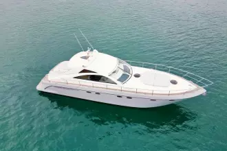 2006 Fairline Targa 52 GT yacht cruising on clear blue water.