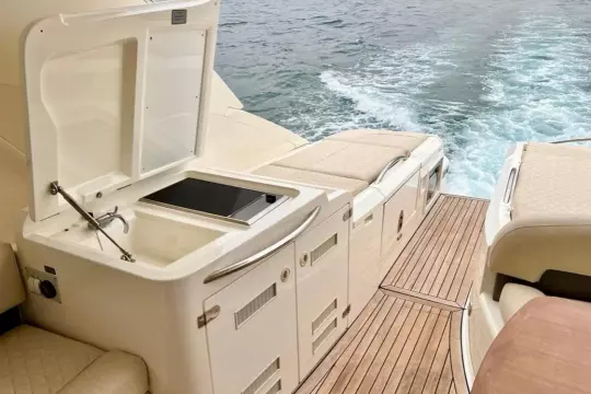 Luxury yacht Fairline Targa 52 GT 2006, featuring a sleek deck and onboard amenities.
