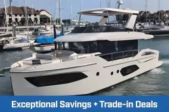 2025 Absolute Navetta 53 yacht in marina, promoting exceptional savings and trade-in deals.
