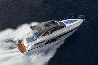 2026 Fairline Targa 50 Open yacht cruising on open water, aerial view.