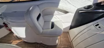 Luxurious interior seating of 2003 Sunseeker Superhawk 34 yacht with wooden flooring.