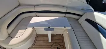 Luxurious seating area on 2003 Sunseeker Superhawk 34 yacht with wooden flooring.