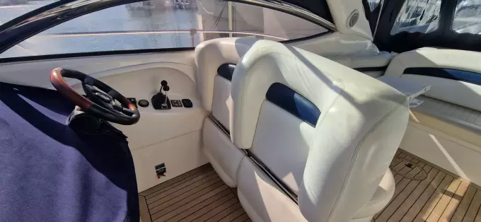2003 Sunseeker Superhawk 34 cockpit with leather seats and wooden flooring.