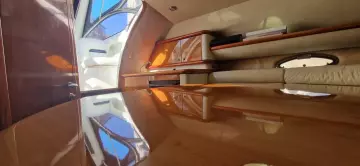 Interior of 2003 Sunseeker Superhawk 34 yacht with polished wood and elegant design.