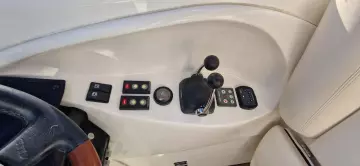 Control panel of 2003 Sunseeker Superhawk 34 yacht with throttle and switches.