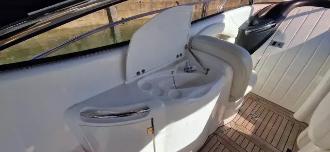 2003 Sunseeker Superhawk 34 yacht interior with sink and seating area.