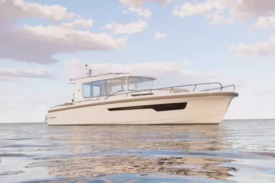 2026 Nimbus Commuter 12 boat on calm water under a partly cloudy sky.