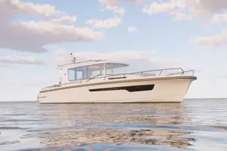 2026 Nimbus Commuter 12 boat on calm water under a partly cloudy sky.