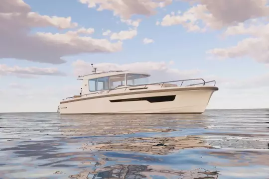 2026 Nimbus Commuter 12 boat on calm water under a partly cloudy sky.