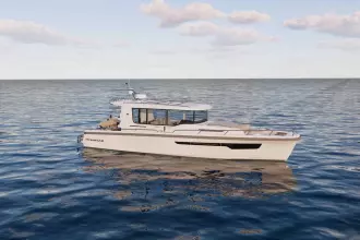 2026 Nimbus Commuter 12 boat on calm ocean waters under a partly cloudy sky.