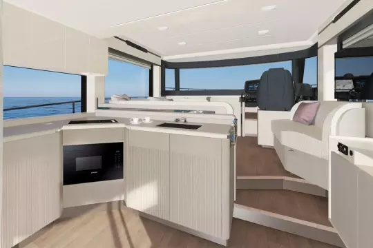 Luxurious interior of 2026 Absolute NAVETTA 50 yacht with modern kitchen and ocean view.