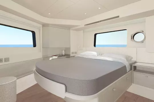 Luxurious bedroom interior of 2026 Absolute NAVETTA 50 yacht with ocean view windows.