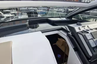 2024 Fairline Targa 45 Open yacht cockpit with modern controls and open cabin view.