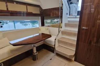 Luxurious interior of 2024 Fairline Targa 45 Open yacht with elegant seating and wooden finishes.