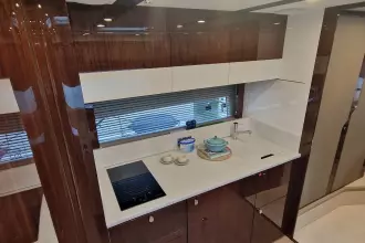 Luxurious kitchen interior of 2024 Fairline Targa 45 Open yacht, featuring modern appliances.