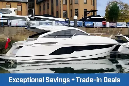2024 Fairline Targa 45 Open yacht docked, showcasing sleek design with trade-in deals promotion.