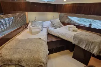 Luxurious 2024 Fairline Targa 45 Open cabin with twin beds and elegant decor.