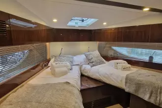 Luxurious cabin interior of 2024 Fairline Targa 45 Open yacht with twin beds.