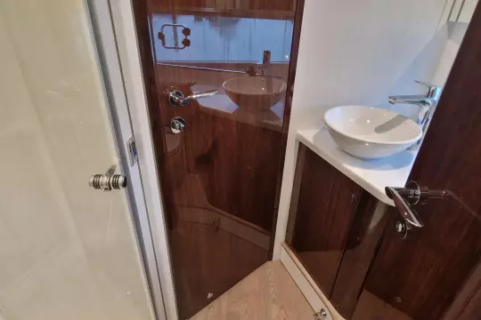 Luxurious bathroom interior of 2024 Fairline Targa 45 Open yacht with modern fixtures.