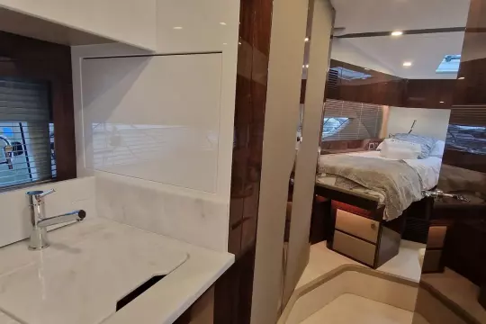 Luxurious interior of 2024 Fairline Targa 45 Open yacht, featuring bedroom and bathroom.