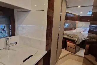 Luxurious interior of 2024 Fairline Targa 45 Open yacht, featuring bedroom and bathroom.
