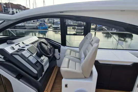 2024 Fairline Targa 45 Open yacht cockpit with modern steering and seating.
