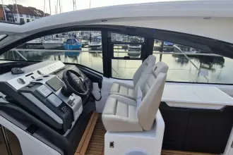 2024 Fairline Targa 45 Open yacht cockpit with modern steering and seating.