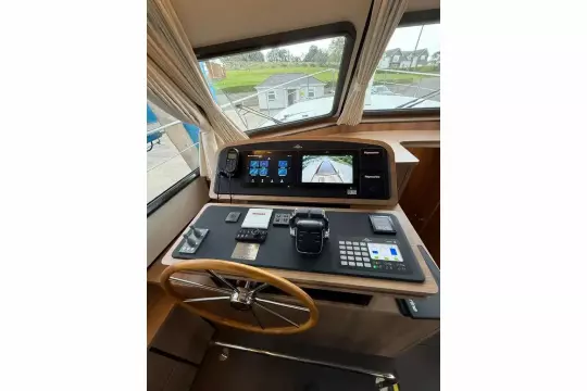 Helm of 2025 Linssen 45 SL Sedan with advanced navigation controls and display screens.