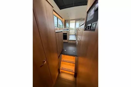 Interior view of 2025 Linssen 45 SL Sedan yacht, featuring modern wood finishes and sleek design.