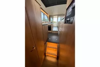 Interior view of 2025 Linssen 45 SL Sedan yacht, featuring modern wood finishes and sleek design.