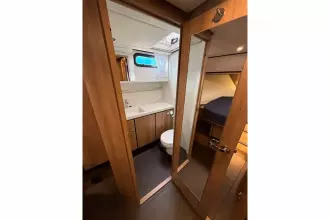 Interior of 2025 Linssen 45 SL Sedan yacht, featuring a modern bathroom and cozy cabin.