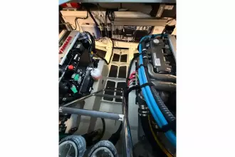 Engine room of 2025 Linssen 45 SL Sedan yacht, showcasing advanced machinery and wiring.