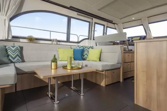 Luxurious interior of 2025 Linssen 45 SL Sedan yacht with modern seating and decor.