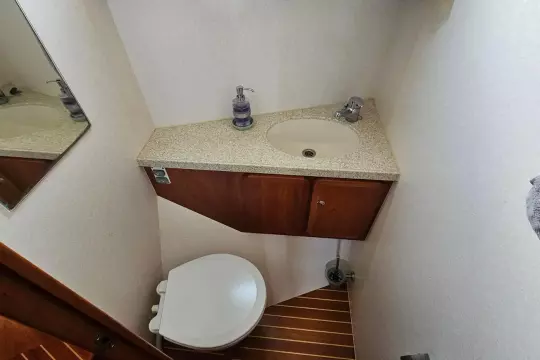 Bathroom interior of 2008 Linssen Grand Sturdy 380 AC yacht, featuring sink and toilet.